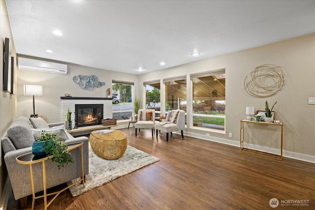 19542 6th Ave NE, Shoreline, WA 98155 - living room featuring a fireplace, recessed lighting, baseboards, a wall unit AC, and wood finished floors