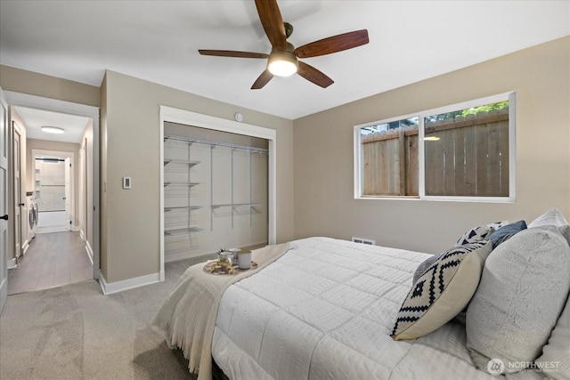 19542 6th Ave NE, Shoreline, WA 98155 - bedroom featuring carpet floors, multiple windows, baseboards, and a closet