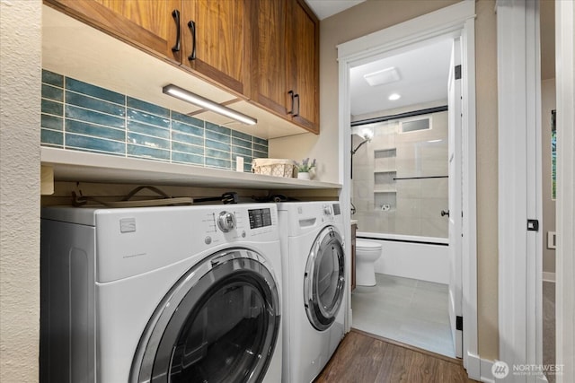 19542 6th Ave NE, Shoreline, WA 98155 - washroom with separate washer and dryer and dark wood-style flooring