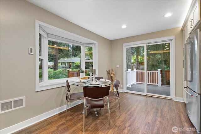 19542 6th Ave NE, Shoreline, WA 98155 - dining space with baseboards, visible vents, and dark wood-type flooring