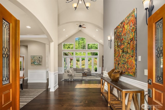 24270 SE 147th Pl, Issaquah, WA 98027 - entryway featuring a towering ceiling, a wainscoted wall, arched walkways, dark wood-style flooring, and a ceiling fan