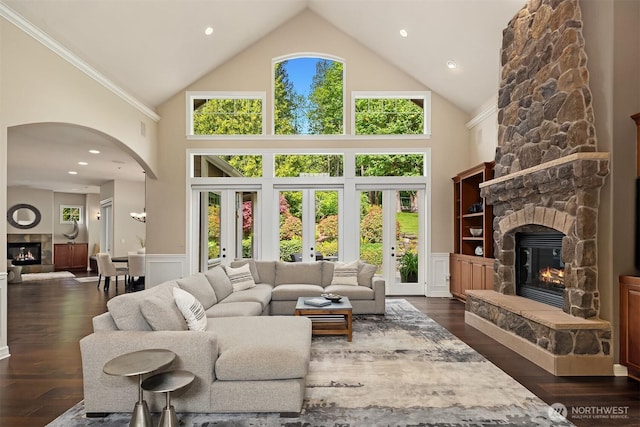 24270 SE 147th Pl, Issaquah, WA 98027 - living room featuring a stone fireplace, high vaulted ceiling, arched walkways, dark wood finished floors, and recessed lighting