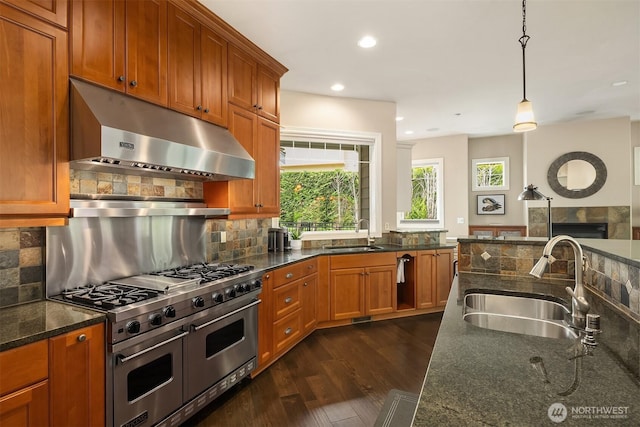 24270 SE 147th Pl, Issaquah, WA 98027 - kitchen with double oven range, under cabinet range hood, a sink, dark wood-style flooring, and recessed lighting