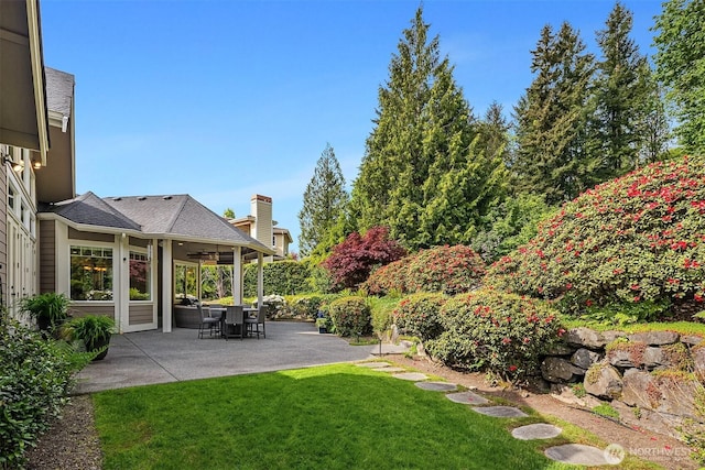 24270 SE 147th Pl, Issaquah, WA 98027 - view of green lawn featuring ceiling fan and a patio area