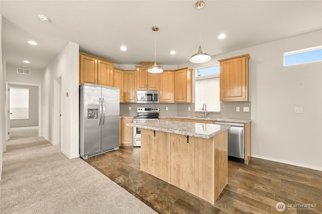 4672 Birch Bay Lynden Rd Unit 87, Blaine, WA 98230 - kitchen featuring stainless steel appliances, a center island, a kitchen breakfast bar, recessed lighting, and hanging light fixtures