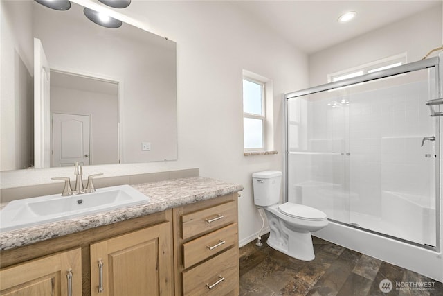 4672 Birch Bay Lynden Rd Unit 87, Blaine, WA 98230 - full bathroom with vanity, a stall shower, toilet, stone finish flooring, and recessed lighting