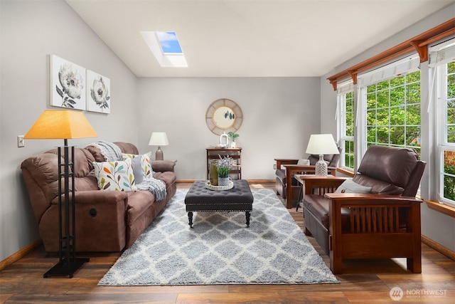 27627 NE 140th Pl, Duvall, WA 98019 - living room with vaulted ceiling with skylight, baseboards, and wood finished floors