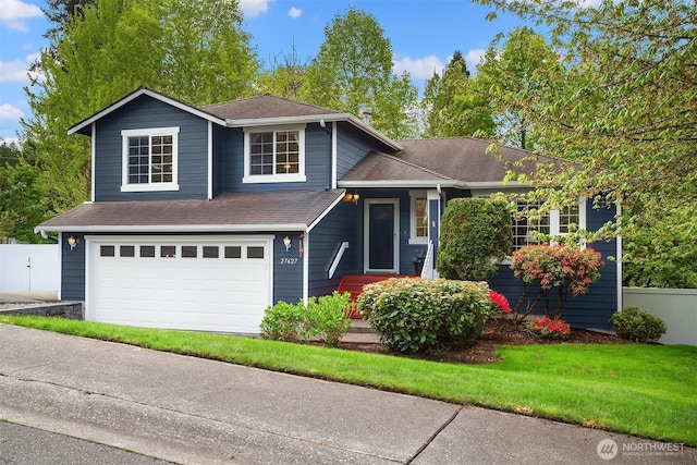 27627 NE 140th Pl, Duvall, WA 98019 - tri-level home featuring fence, a shingled roof, and a garage