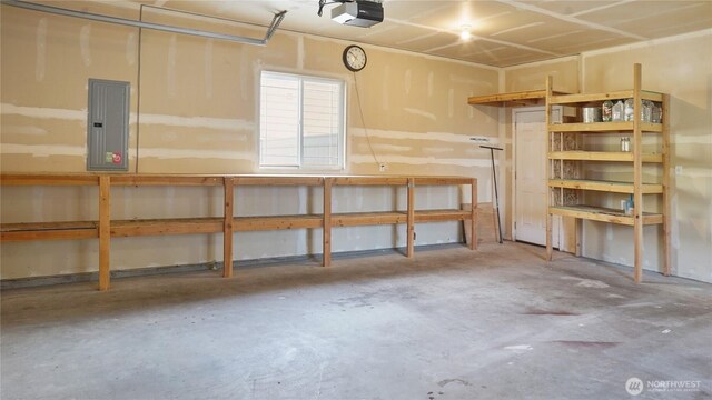 garage featuring a garage door opener and electric panel