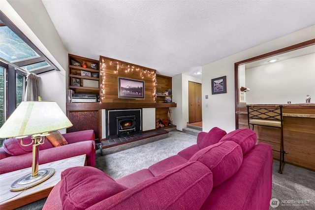 carpeted living area featuring a textured ceiling