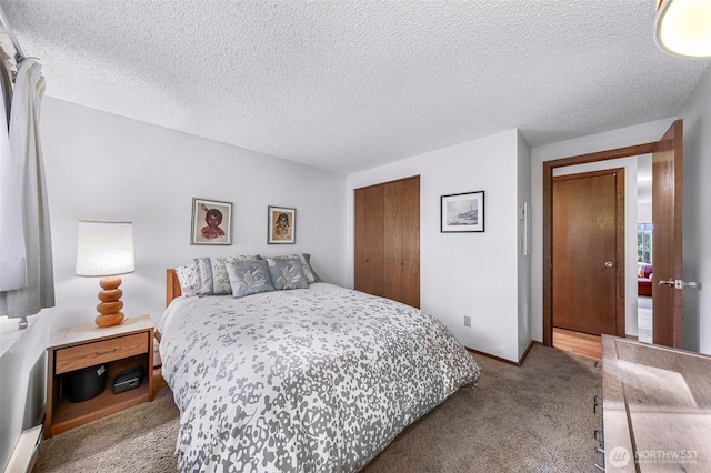 carpeted bedroom with baseboards, a closet, and a textured ceiling