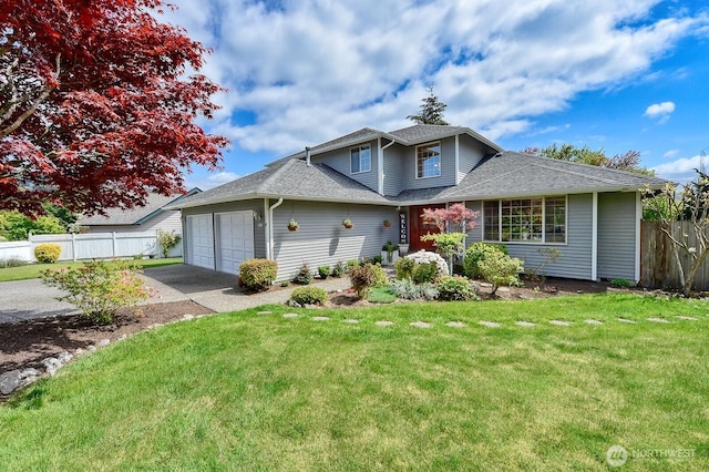 3506 S Grace Ln, Bellingham, WA 98226 - traditional-style home featuring an attached garage, fence, a shingled roof, and a front lawn