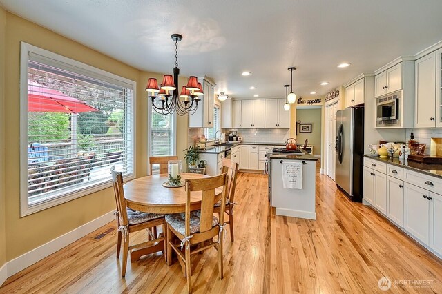 3506 S Grace Ln, Bellingham, WA 98226 - dining room with recessed lighting, baseboards, an inviting chandelier, visible vents, and light wood-type flooring