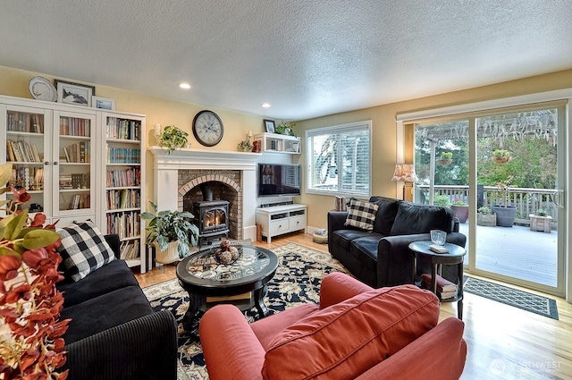 3506 S Grace Ln, Bellingham, WA 98226 - living room featuring a textured ceiling, wood finished floors, and recessed lighting