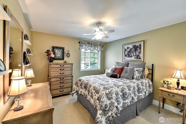 3506 S Grace Ln, Bellingham, WA 98226 - bedroom with a ceiling fan, baseboards, and light carpet