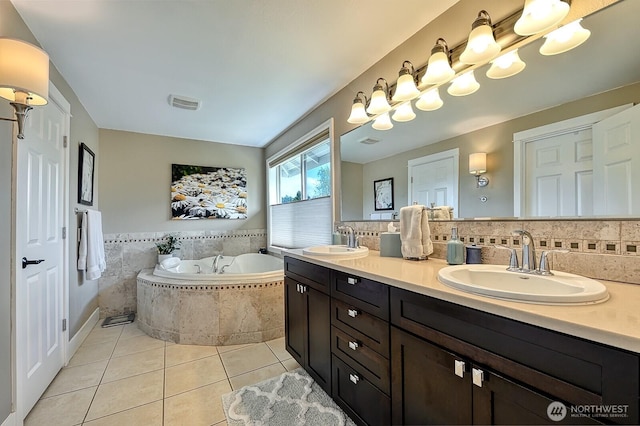 3506 S Grace Ln, Bellingham, WA 98226 - full bathroom with tile patterned floors, a garden tub, a sink, and double vanity