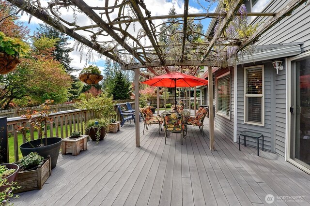 3506 S Grace Ln, Bellingham, WA 98226 - wooden deck with a pergola, fence, and outdoor dining space