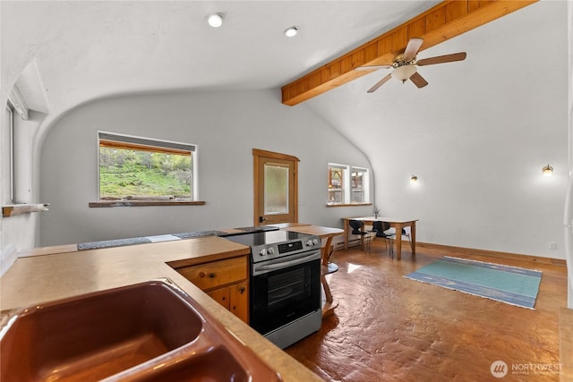 811 Filer Ave, Winthrop, WA 98862 - kitchen featuring a ceiling fan, vaulted ceiling with beams, finished concrete floors, a sink, and stainless steel electric range oven