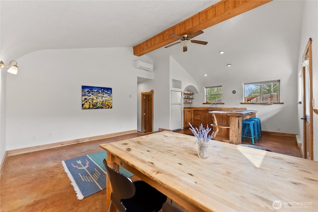 811 Filer Ave, Winthrop, WA 98862 - dining room featuring ceiling fan, an AC wall unit, high vaulted ceiling, baseboards, and beamed ceiling