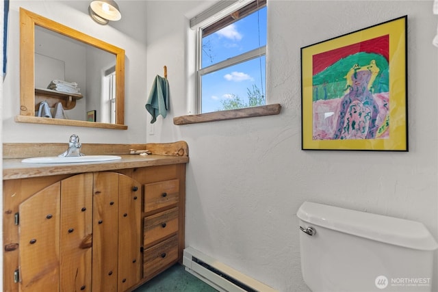 811 Filer Ave, Winthrop, WA 98862 - bathroom featuring vanity, baseboard heating, and toilet