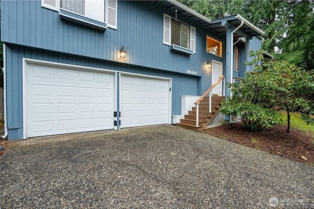 exterior space featuring an attached garage and driveway