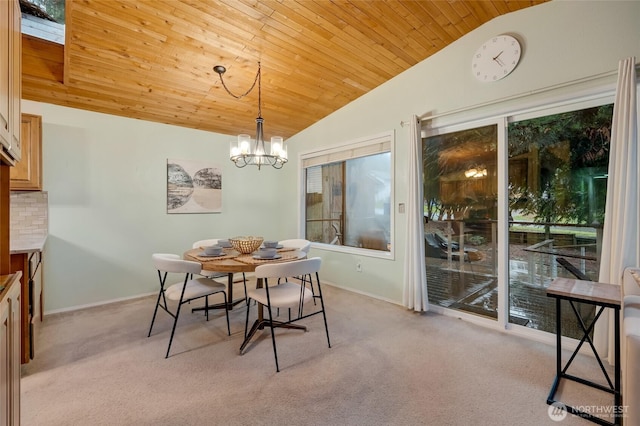 dining room with a chandelier, light colored carpet, wooden ceiling, and lofted ceiling