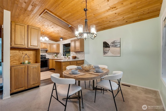 dining room featuring a chandelier, visible vents, wooden ceiling, lofted ceiling, and light carpet