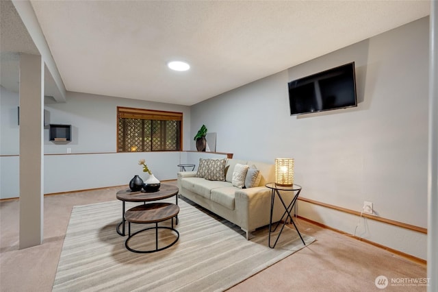 living room with carpet floors and baseboards