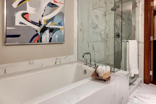 full bath with a garden tub, marble finish floor, and a marble finish shower