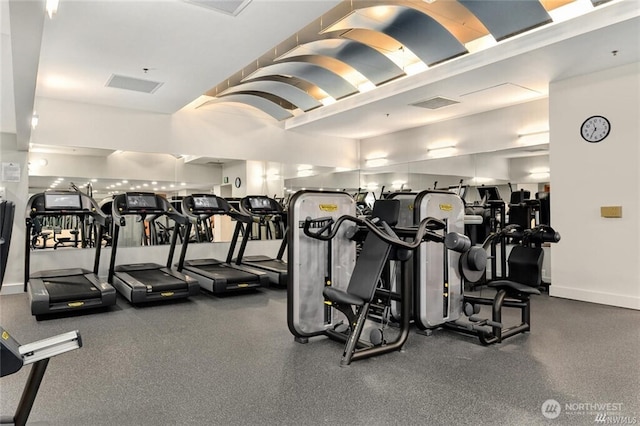exercise room featuring baseboards