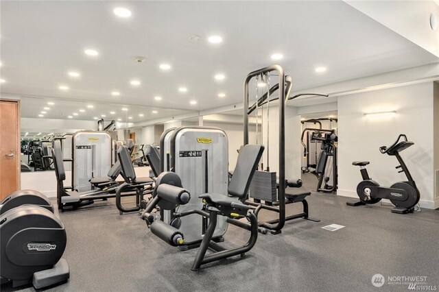 exercise room featuring recessed lighting and baseboards