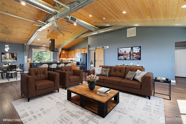 living area featuring light wood-style flooring, a barn door, wood ceiling, ceiling fan, and recessed lighting