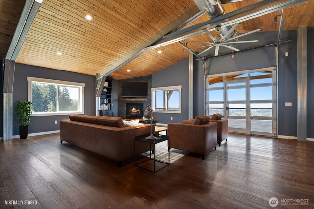 living area with wooden ceiling, baseboards, a ceiling fan, a fireplace, and hardwood / wood-style flooring