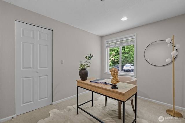 home office featuring baseboards and light colored carpet