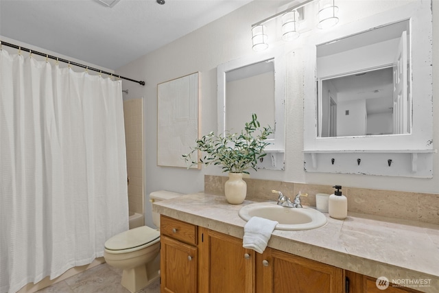 full bathroom with vanity, toilet, and shower / tub combo with curtain