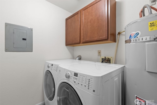 laundry room featuring washer and dryer, cabinet space, water heater, and electric panel
