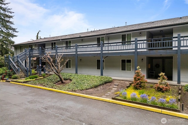 view of building exterior featuring stairs