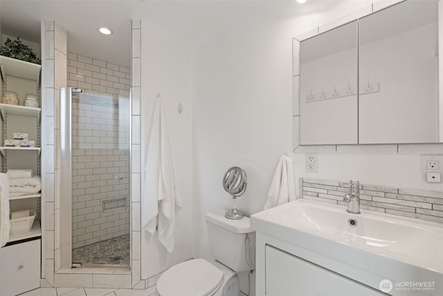 full bath featuring vanity, toilet, a shower stall, and recessed lighting