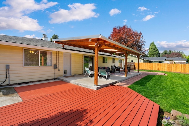 deck with a yard, fence, and a patio