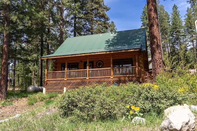 45 Fawn Creek Rd E, Winthrop, WA 98862 - view of front of property with a porch, metal roof, and log exterior