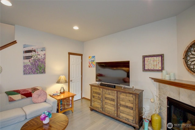 454 S 48th St, Mount Vernon, WA 98274 - living room featuring recessed lighting, a tiled fireplace, and wood finished floors