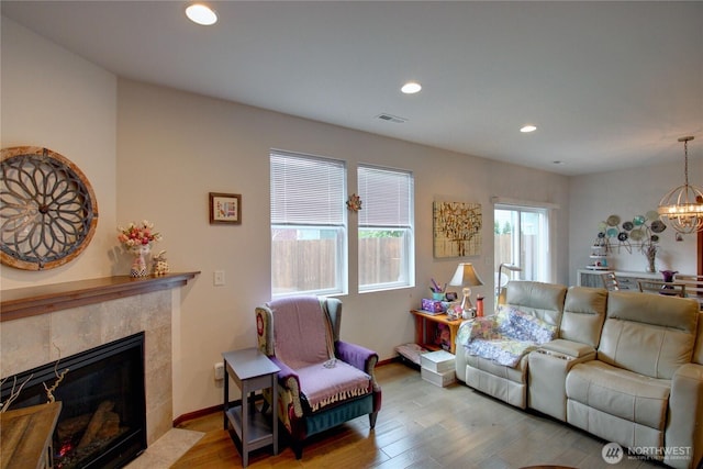 454 S 48th St, Mount Vernon, WA 98274 - living area with visible vents, a tile fireplace, wood finished floors, a chandelier, and recessed lighting