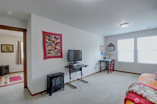 454 S 48th St, Mount Vernon, WA 98274 - carpeted living area featuring baseboards and a wood stove