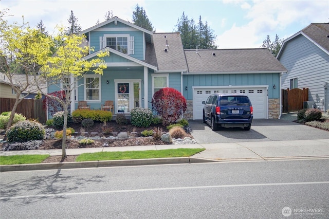 454 S 48th St, Mount Vernon, WA 98274 - view of front of home with a garage, board and batten siding, fence, and driveway