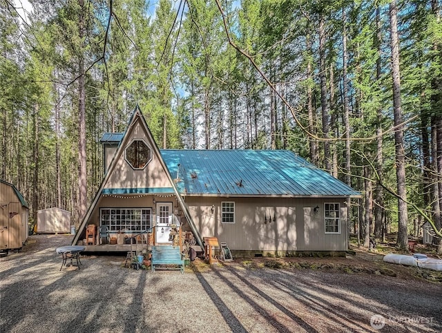 121 Sunstone Rd, Packwood, WA 98361 - rear view of property featuring a wooden deck and metal roof
