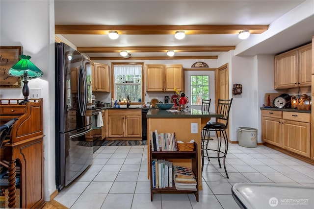 121 Sunstone Rd, Packwood, WA 98361 - kitchen with a kitchen island, black appliances, dark countertops, and a kitchen bar