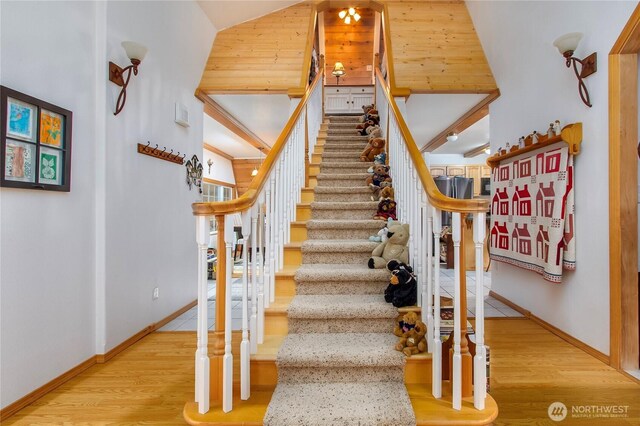 121 Sunstone Rd, Packwood, WA 98361 - stairway featuring baseboards, a high ceiling, and wood finished floors