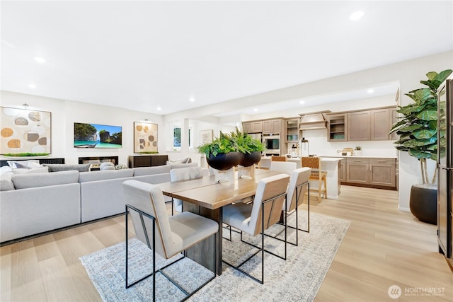 dining room featuring recessed lighting and light wood-style flooring
