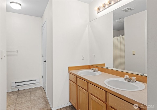 full bathroom featuring a sink, a baseboard radiator, double vanity, and visible vents