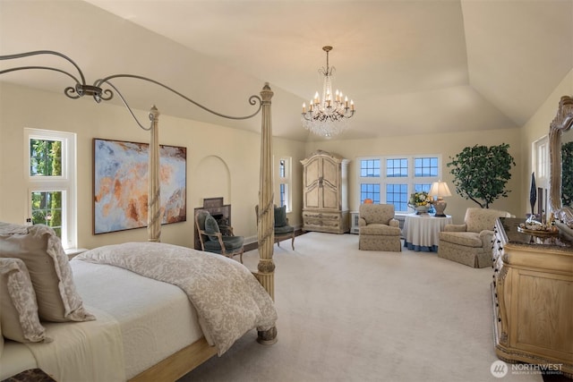 bedroom with lofted ceiling, multiple windows, carpet flooring, and an inviting chandelier